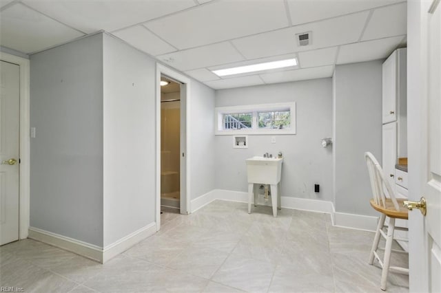 washroom with laundry area, hookup for a washing machine, visible vents, and baseboards