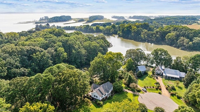 aerial view with a forest view and a water view