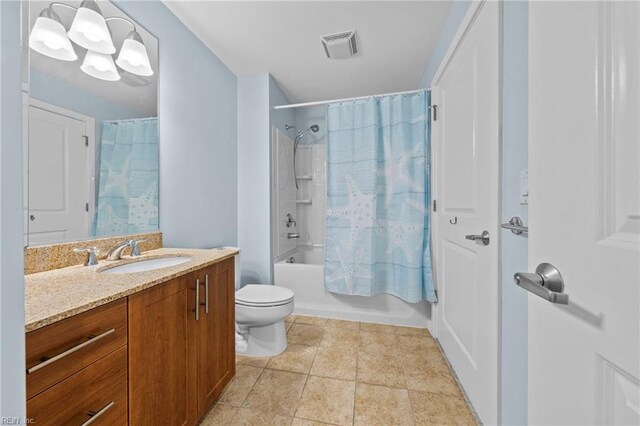 bathroom with toilet, vanity, visible vents, tile patterned floors, and shower / bath combo