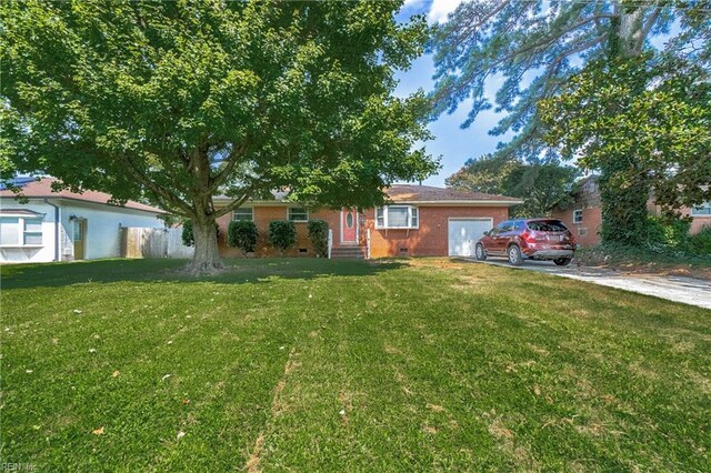 single story home with a garage and a front lawn