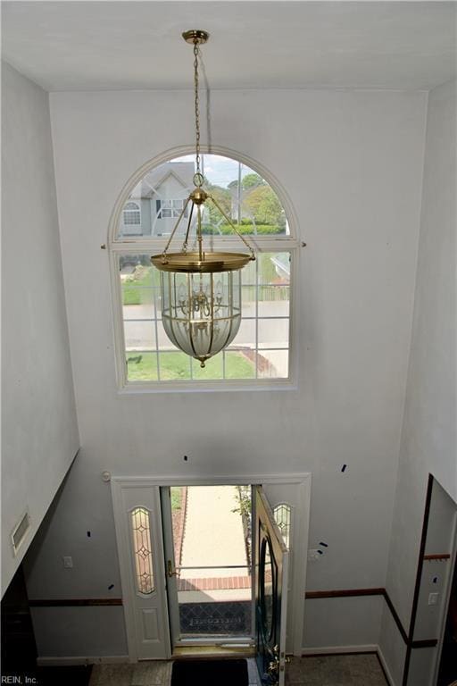 6703 Chambers Ln, Suffolk, VA 23435 - entrance foyer with a notable chandelier, baseboards, and visible vents