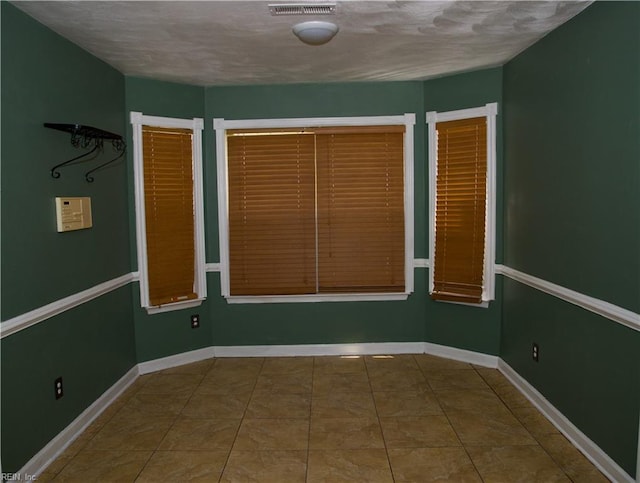 6703 Chambers Ln, Suffolk, VA 23435 - tiled empty room featuring baseboards