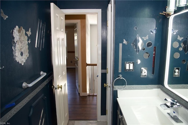 6703 Chambers Ln, Suffolk, VA 23435 - bathroom featuring vanity, baseboards, and wood finished floors