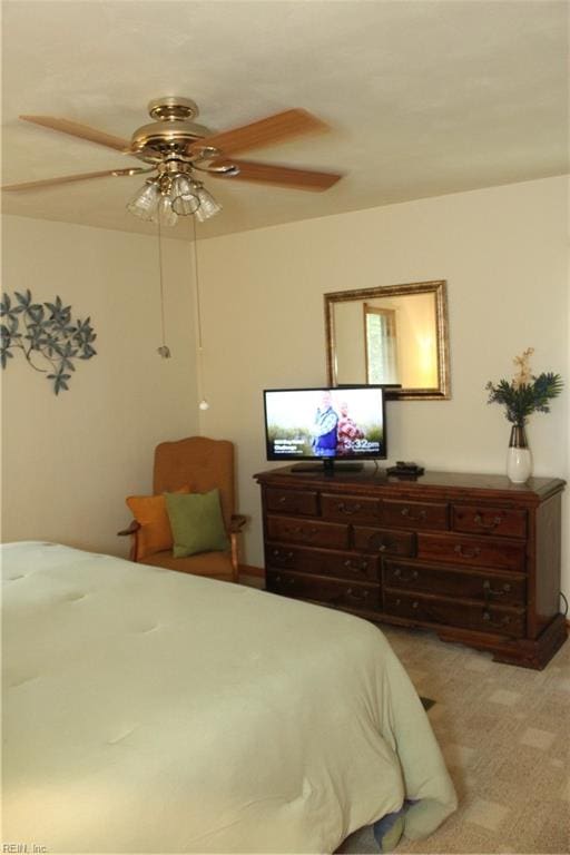 bedroom featuring light colored carpet and ceiling fan