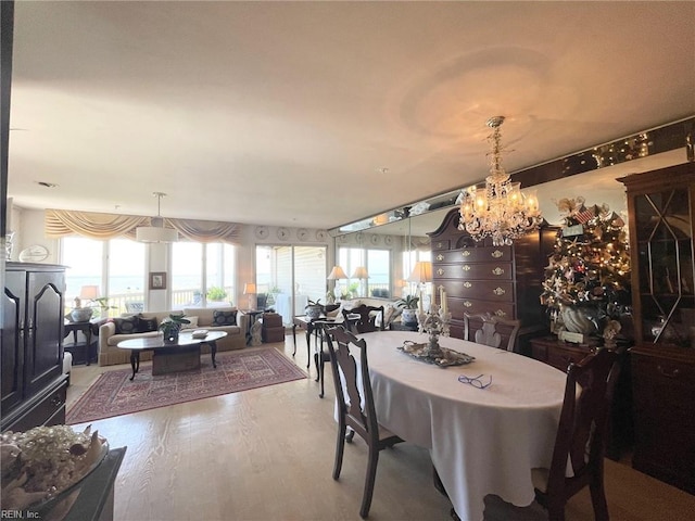 dining space with wood-type flooring and a wealth of natural light