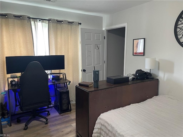 bedroom featuring hardwood / wood-style flooring