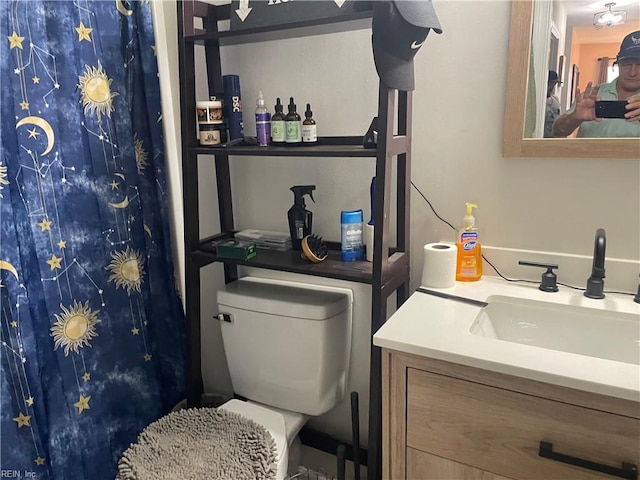 bathroom with vanity and toilet