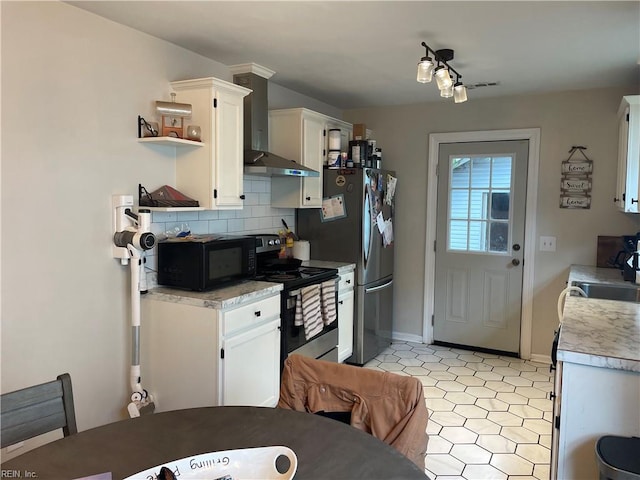 kitchen featuring backsplash, stainless steel appliances, sink, wall chimney exhaust hood, and white cabinets