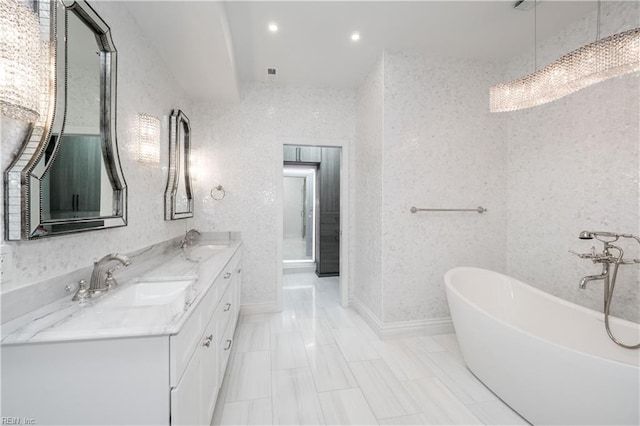 bathroom featuring a tub and vanity