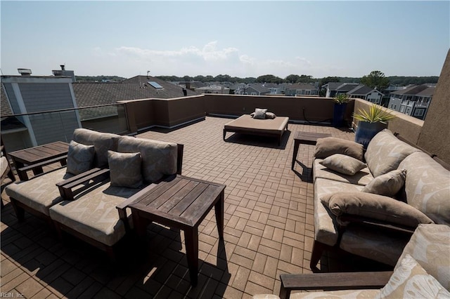 view of patio with a balcony and an outdoor living space