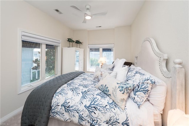 carpeted bedroom with ceiling fan