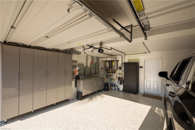 garage featuring electric panel and a garage door opener