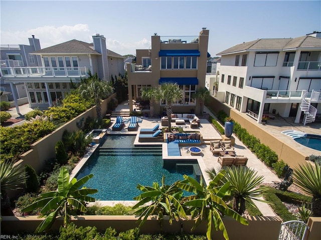 view of pool featuring outdoor lounge area and a patio