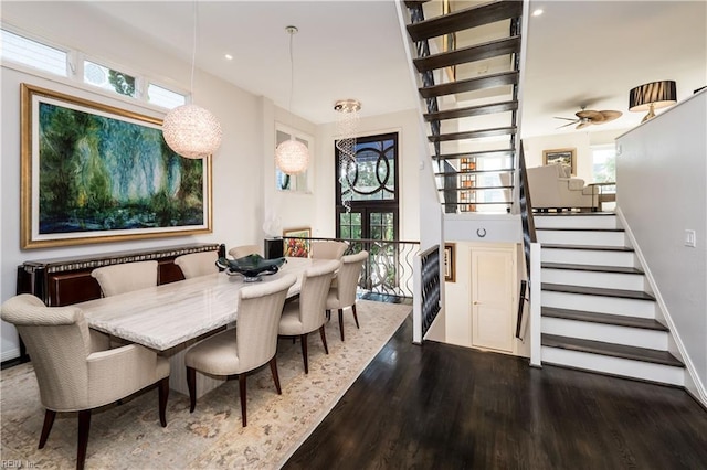 dining space with dark wood-type flooring, ceiling fan, and a wealth of natural light