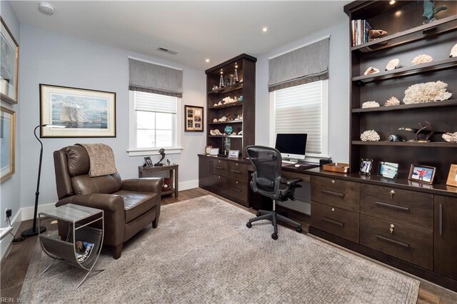 office space with light hardwood / wood-style flooring