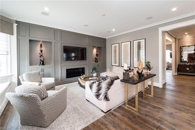 living room featuring ornamental molding and dark hardwood / wood-style floors