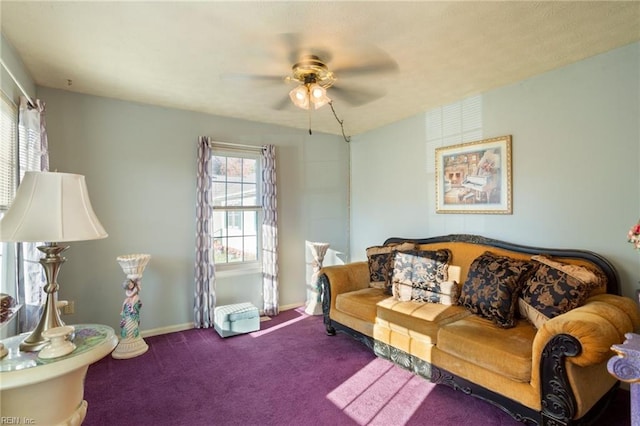 living room featuring ceiling fan and carpet