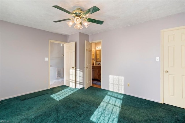 empty room with carpet flooring and ceiling fan