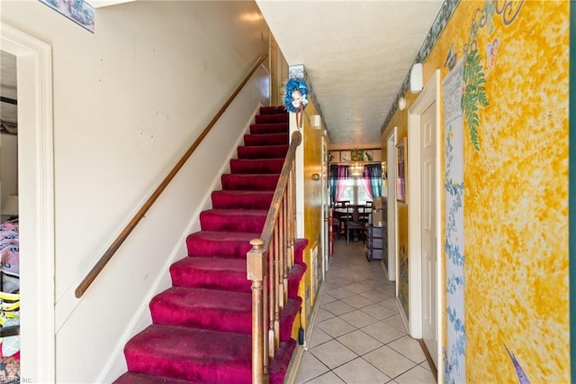 stairway with tile patterned flooring