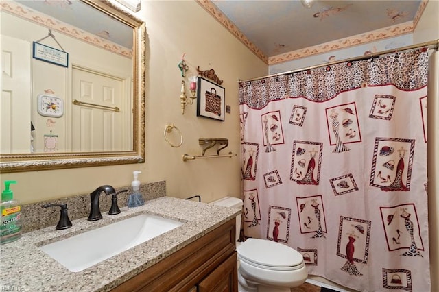 bathroom featuring curtained shower, vanity, and toilet