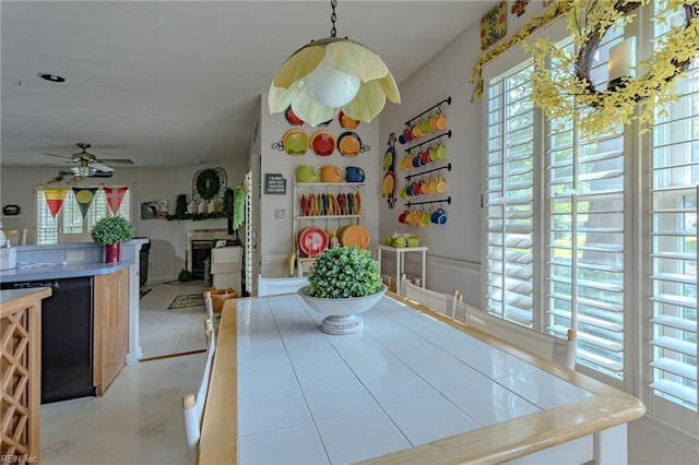 unfurnished dining area featuring ceiling fan