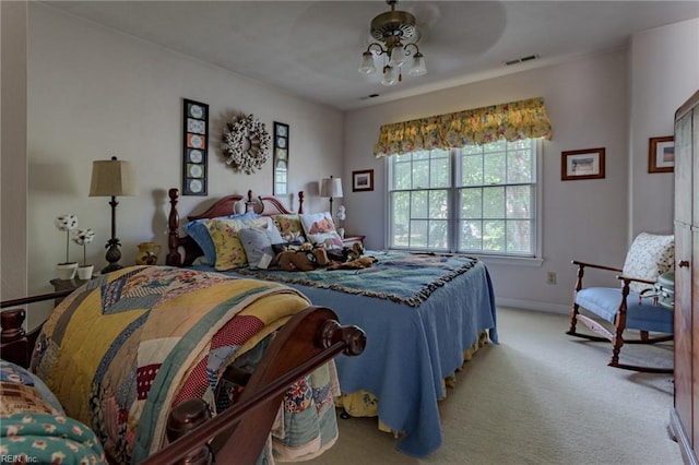 bedroom with visible vents, light colored carpet, and baseboards