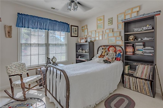 bedroom with baseboards, carpet, visible vents, and ceiling fan