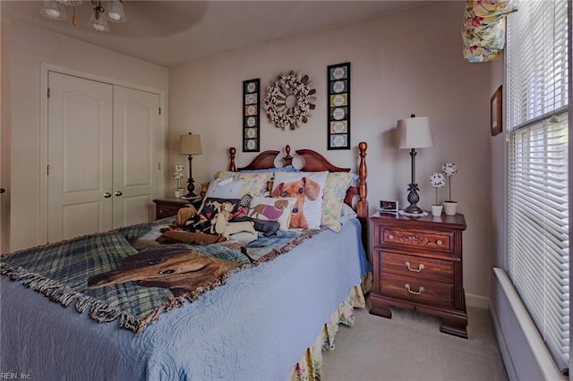 carpeted bedroom featuring a closet