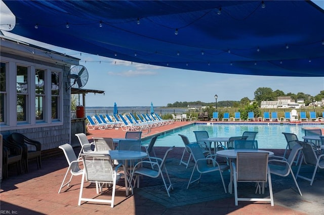 view of patio / terrace with outdoor dining area and a community pool