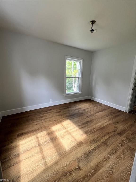 spare room featuring hardwood / wood-style flooring