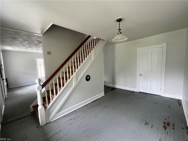 stairway featuring hardwood / wood-style flooring