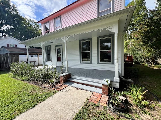 view of front of home with a front lawn and a porch