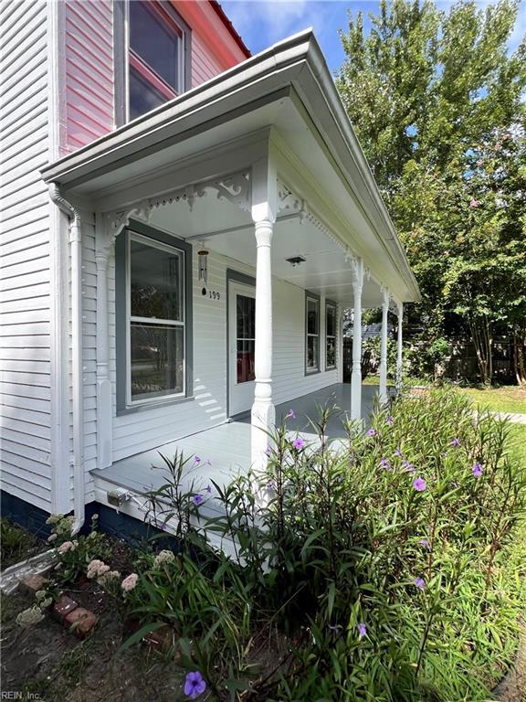 view of side of property with a porch