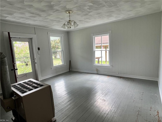 interior space featuring hardwood / wood-style floors and a chandelier