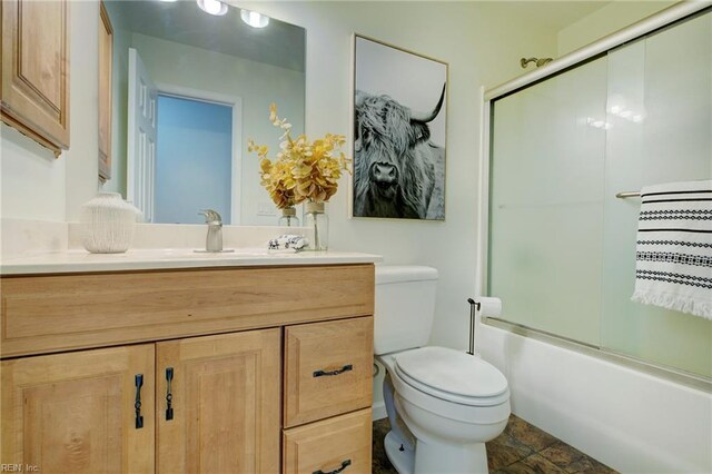 bathroom with vanity, a bathing tub, a notable chandelier, and a healthy amount of sunlight