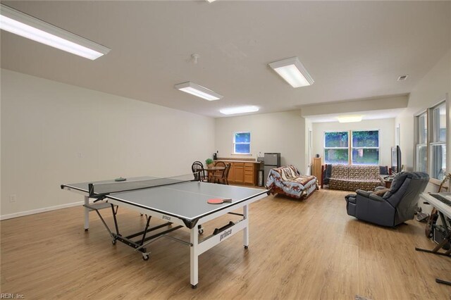 exercise room featuring light hardwood / wood-style floors