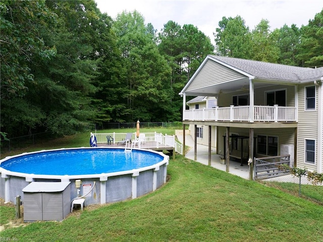 view of swimming pool with a yard and a patio area