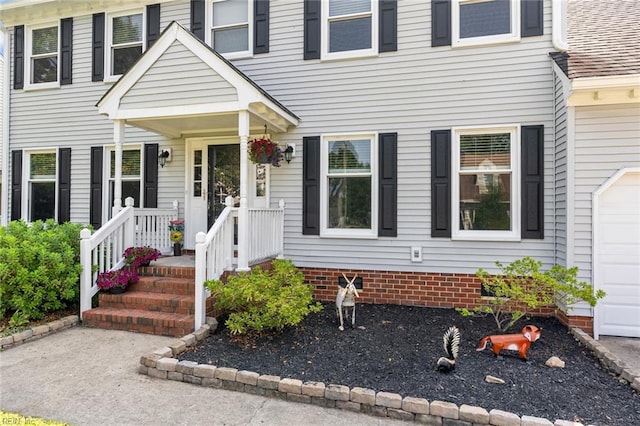 property entrance with covered porch