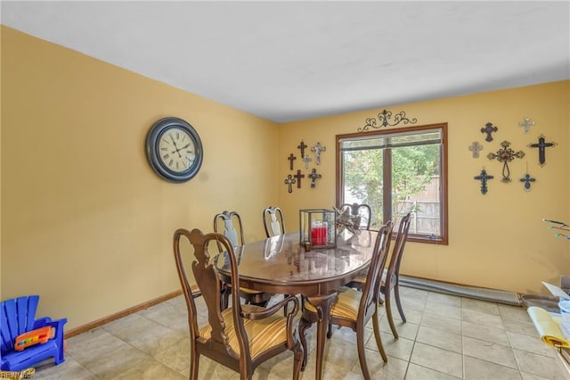 dining area featuring light tile patterned flooring