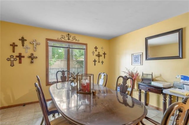 dining room with light tile patterned flooring