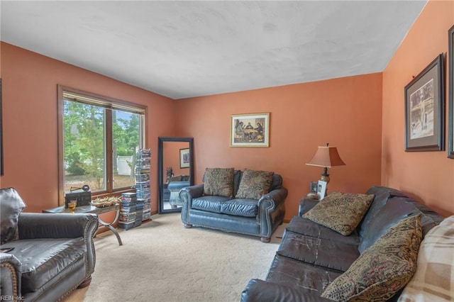 living room featuring carpet flooring and a fireplace