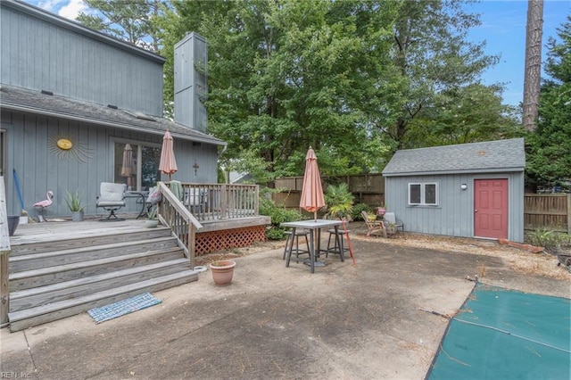 view of patio with a shed and a deck