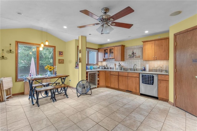 kitchen with backsplash, wine cooler, ceiling fan, hanging light fixtures, and stainless steel dishwasher