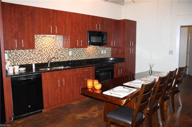 kitchen featuring sink, black appliances, and tasteful backsplash