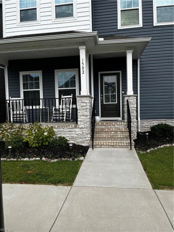 entrance to property with covered porch