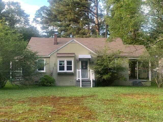 bungalow with a front lawn