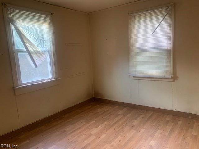 empty room with light hardwood / wood-style flooring