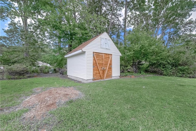 view of outdoor structure with a lawn