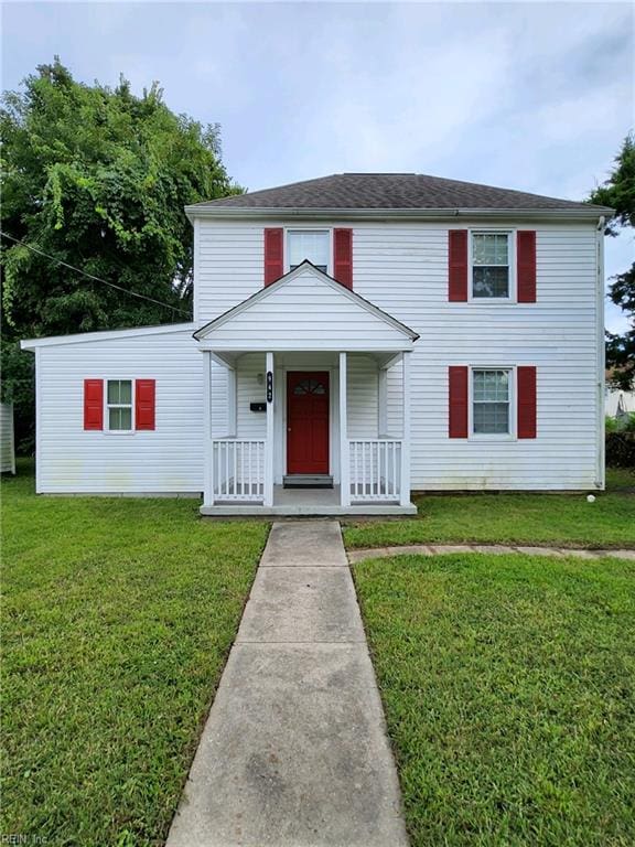 view of front of property with a front lawn and covered porch