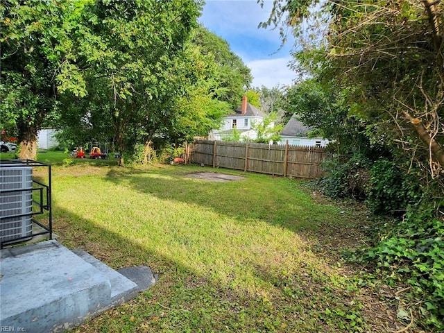 view of yard with central AC unit